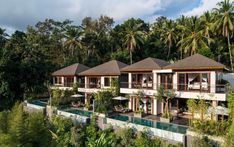 the resort is surrounded by lush vegetation and trees, with several rooms on each level