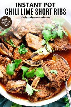 instant pot chili short ribs in a white bowl with cilantro garnish