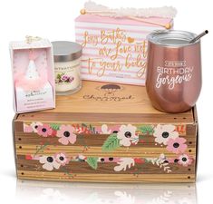 the birthday girl gift set includes a pink flowered box, candle, and cup