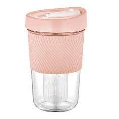 a glass cup with a pink lid