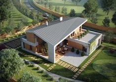 an aerial view of a modern house in the countryside