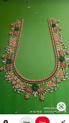 a green and gold necklace with jewels on the bottom is shown in an instagramtion