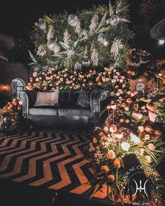 a living room decorated with flowers and candles