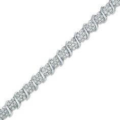 Dress her wrist in the bright luxury of this diamond tennis bracelet. Crafted in cool sterling silver, this shimmering design features sparkling diamonds separated by polished "S"-shaped swirls. Radiant with 1-1/2 cts. t.w. of diamonds and a brilliant buffed luster, this 7.0-inch bracelet is certain to be an everyday favorite. This bracelet secured with a tongue and groove clasp. Engagement Rings And Wedding Band, Sculptural Bracelet, Buy Earrings Online, Textured Bracelet, Enchanted Jewelry, Beautiful Bracelets, Gems Bracelet, Buy Earrings, Diamond Tennis Bracelet