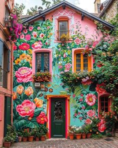 a colorful building with flowers painted on it