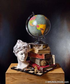 a busturine with books and a globe on top