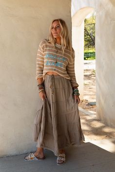 A boho closet isn't complete without the perfect maxi skirt and you can't choose a better style than the Sardinia Silky Tiered Maxi Skirt! So chic, You'll love the style of this show - stopping skirt because it features: Pretty silky Rayon gauze fabric (slightly sheer) Relaxed and loose maxi skirt silhouette High - rise waistline with an elastic drawstring waistband with tassel beaded details Gathered tiers throughout for added movement and style Short lining for added coverage Pair with: Lace E Boho Essentials, Chic Skirt, Bralette Outfit, Tiered Maxi Skirt, Better Style, Denim Day, Gauze Fabric, Sweater Sale