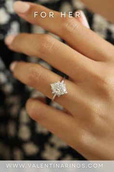 a woman's hand with a diamond ring on it and the words, how to wear an engagement ring for her