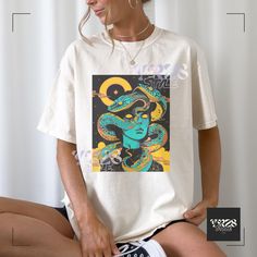 This dark art surrealism graphic tee exudes a nostalgic, alternative vibe. Perfect for those who appreciate creepy, weird, and vintage grunge aesthetics. The oversized fit makes it comfortable for casual wear or as a statement piece in a semi-formal setting. Ideal for those who love dark illustrations and want a unique, edgy look. Great for Halloween, goth events, or everyday wear. 🍓Relaxed fit (Unisex) 🍓100% ring-spun US cotton (fiber content may vary by color) 🍓Medium-heavy weight fabric 🍓Runs slightly larger than standard women's tees for a laid-back feel 🍓For the perfect fit, refer to our sizing chart in the photos. Simply lay your favorite tee flat, measure from armpit to armpit, and match it with the chart. Care Tips: 🍓Machine Wash: Cold water (up to 30oC or 90oF) 🍓Avoid ironi Vintage Occult, Grunge Aesthetics, Graphic Tee Vintage, Halloween Goth, Art Surrealism, Fantasy Design, Vintage Grunge, Edgy Look, Unisex Tshirt