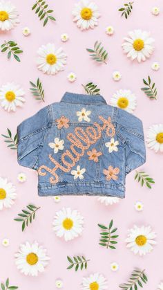 Custom hand embroidered denim jacket.  When purchase comment with name and colors you would like. Can do flowers, sun, rainbow, bee, clouds, if there's a design you would like you can message me. Cute Cotton Denim Jacket, Customizable Blue Denim Jacket For Spring, Customizable Cute Cotton Outerwear, Cute Customizable Cotton Outerwear, Customizable Spring Denim Jacket, Customizable Denim Jacket For Spring, Spring Customizable Denim Jacket, Handmade Trendy Outerwear For Spring, Trendy Handmade Spring Outerwear