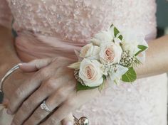 a bride holding her wedding bouquet in her hand