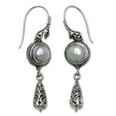 With their refined elegance and grace these cultured pearl dangle earrings from artisan Kadek Hendra are sure to impress. Crafted from carefully detailed sterling silver the earrings feature floral motifs as well as traditional Balinese styling..925 Sterling silver Traditional Pearl Drop Earrings In Sterling Silver, Silver Pearl Drop Earrings With Intricate Design, Elegant Round Pearl Earrings With Intricate Design, Ornate Sterling Silver Earrings With Elegant Design, Classic Intricate Dangle Earrings, Elegant Sterling Silver Pearl Earrings Nickel Free, Elegant Sterling Silver Nickel-free Pearl Earrings, Silver Filigree Drop Pearl Earrings, Elegant Silver Pearl Earrings With Filigree