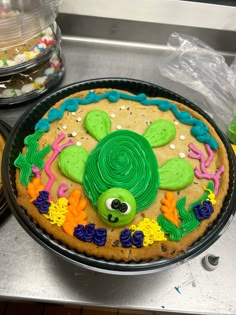 there is a decorated cookie in the shape of a turtle