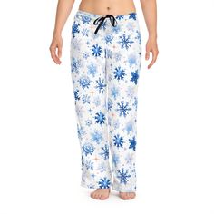 "🌟 ORDER BY 𝐃𝐄𝐂𝐄𝐌𝐁𝐄𝐑 𝟖 TO ARRIVE IN TIME FOR 𝐂𝐇𝐑𝐈𝐒𝐓𝐌𝐀𝐒 🎁 🌨️ Winter Wonderland PJ Pants for Women 🌨️ Prepare to snuggle up in the most enchanting winter-themed pajama pants ever with our White Snowflake PJ Pants for Women. These cozy pajama bottoms are adorned with delicate blue snowflakes, adding a touch of wintery magic to your sleepwear collection. ❄️ Pajama Pants Details ❄️ Our winter-inspired pajama pants are a celebration of all things cozy and festive. Featuring a charming pattern of blue snowflakes, they set the stage for a dreamy and warm winter night. ❄️ Why Choose Our Pajama Bottoms? ❄️ Premium Comfort: Crafted from high-quality, soft, and breathable fabric, our pajama pants ensure a comfortable night's sleep while keeping you stylishly snug in the winter ch Christmas Holiday Long Pants Sleepwear, Christmas Holiday Sleepwear With Long Pants, Christmas Pajama Party Sleepwear Long Pants, Blue Cotton Holiday Sleepwear, Blue Cotton Christmas Sleepwear, Cozy Christmas Bottoms For Pajama Party, Cozy Christmas Pajama Party Bottoms, Cozy Bottoms For Christmas Pajama Party, Blue Winter Sleep Bottoms