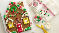 a gingerbread house decorated with icing and candy