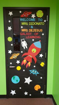 a classroom door decorated with an outer space theme and the words welcome to mrs didonato