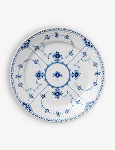 a blue and white plate with an ornate design on the rim, against a white background