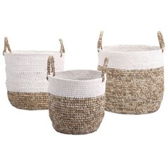 three white and brown baskets with handles