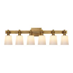 a bathroom light fixture with five lights on the side and four white shades in front