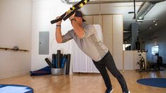 a man is doing exercises in the gym