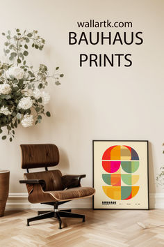 an eames chair next to a poster with the words bauhaus prints on it