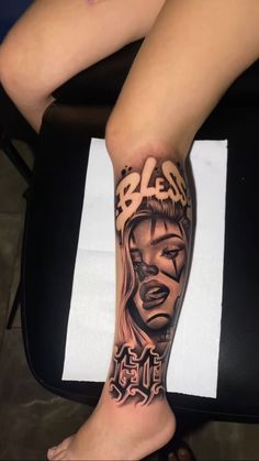 a woman's leg with tattoos on it and the word bleap written in black