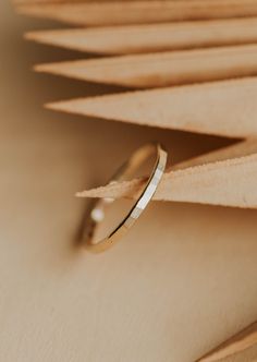 Hammered and handsome, the Aden Band is truly an ICON all on its own. Absolutely stackable and absolutely a favorite, let's elevate your ring game! Band is 1.5mm wide and is lightly hammered. Available in 14kt Gold Fill + Sterling Silver. Pair with any of our stacking bands, but we love it with our Teeny-Tiny Band, Cigar Band, and Beaded Ring. Jess B. wears it with our Dylan Chain Ring and Confetti Ring. Handmade in Eau Claire, WI. Our jewelry is handmade so each piece will be unique and may var Confetti Ring, Gold Stacking Rings, Ribbon Ring, Simple Rings, Everyday Wear Jewelry, Ring Game, Minimal Ring, Beaded Ring, Stacking Bands