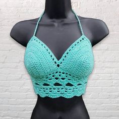 This crochet bikini top is perfect for hot sunny days dancing to your favorite band at a festival or lounging on the beach. It is made with soft cotton yarn and ties in the back in a corset style criss-cross and around the neck, making it adjustable to fit different sizes. Shown in aqua and coral, available in many other colors upon request! Want padding added? Add this listing to your order and choose from either push up or regular foam padding. https://www.etsy.com/listing/399021473/add-paddin Festival Mode, Cotton Bralette, Bohemian Style Clothing, Music Festival Fashion, Stunning Tops, Womens Halter Tops, Boho Beauty, Crochet Halter, Crochet Summer Tops