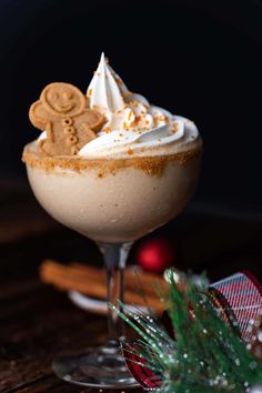 a drink with whipped cream and ginger cookies on top