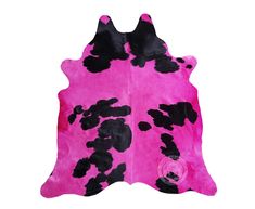 a pink cowhide rug with black spots on the bottom and sides, in front of a white background