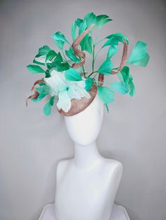 From the 2024 Featured Milliner of the Kentucky Derby Museum  Gorgeous Kentucky Derby hat fascinator  kentucky derby hat fascinator taupe beige sinamay and curls green  feathers and mint green feather flowers headband attachment  each hat is totally one of a kind! no two are alike! I can probably add feathers, flowers etc to existing hats for a small fee. I cannot remove anything from existing hats. Just message me and see if we can make it work! :) I cannot make custom order from scratch. My sc Green Mini Hats With Feathers For Royal Ascot, Kentucky Derby Green Fascinator With Handmade Flowers, Green Feathered Mini Hat For Royal Ascot, Green Feathered Mini Hat For Kentucky Derby, Green Wide Brim Fascinator For Kentucky Derby, Luxury Green Headpiece For Kentucky Derby, Green Feathered Fascinator For Kentucky Derby, Luxury Green Fascinator For Party, Luxury Green Fascinator For Races