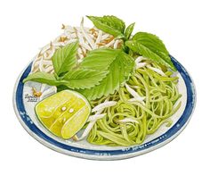 a plate filled with noodles and vegetables covered in green leafy toppings on top of it