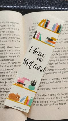 a bookmark that reads i have no self cant with bookshelves in the background