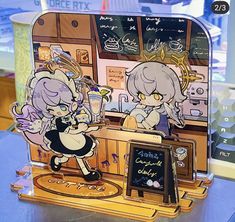 a display case with two cartoon characters on it's sides and a chalkboard in the background