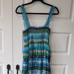 Nwt: Anthropologie- Chaudry Kc Ruched Maxi Dress Size Medium Color: Multi Pattern Blues And Greens *Maxi Dress *Ruched At Chest *Adjustable Elastic Ruffle Straps *Crinkled Garment *Square Neck *Ruffled Neckline *Light Pleating *Lined Mid-Section *Flowy *Made In India *100 Cotton Approx. Measurements (Lying Flat) Across Top Of Chest 13" Length Top Of Chest To Bottom 48" The Beautiful Colors Of This Maxi Dress Really Stand Out! It's A Light Weight Flowy Dress That Can Be Dressed Up Or Down! # Flow Blue Ruched Sundress Maxi Dress, Casual Blue Ruched Maxi Dress, Blue Mini Dress With Smocked Bodice For Beach, Blue Sleeveless Mini Dress With Smocked Bodice, Blue Ruched Sundress For Vacation, Blue Sundress With Smocked Back, Casual Blue Ruched Sundress, Blue Ruched Sundress With Flowy Fit, Blue Ruched Flowy Sundress