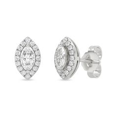 The Marquise Halo Studs are elegant diamond earrings that feature marquise-cut diamonds encircled by halos of round diamonds. The earrings are made of solid gold and have secure pushbacks. These are classy and versatile earrings that will complement any outfit. Formal Marquise Cluster Earrings With Brilliant Cut, Marquise Diamond Earrings With Diamond Accents For Formal Occasions, Marquise Diamond Cluster Earrings For Formal Occasions, Marquise Cut Diamond Cluster Earrings For Formal Events, Marquise Cut Diamond Cluster Earrings For Formal Occasions, Formal Marquise-cut Diamond Cluster Earrings, Formal Marquise Cut Diamond Cluster Earrings, Formal Marquise Diamond Cut Cluster Earrings, Oval Halo Design Cluster Earrings For Formal Occasions