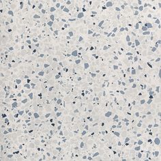 a white and blue speckled wallpaper with black dots on the bottom right corner