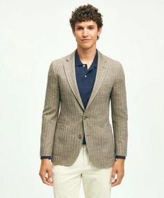 Our commitment to comfort, quality and innovation is second to none. To wit: our knit sport coat that looks as sharp as the best woven tailored pieces in your closet and feels as comfortable as your favorite sweatshirt. This style features a classic herringbone pattern that adds a sophisticated touch to both casual and dressed-up looks alike..CLASSIC FIT: Our average fit across chest, body and sleeves. (formerly known as Regent Fit).2-button; side vents; butterfly lining; finished sleeves.67% Co Casual Semi-formal Blazer For Fall, Casual Tailored Tweed Jacket With Suit Collar, Casual Tweed Jacket With Suit Collar For Business Casual, Business Casual Tweed Jacket With Suit Collar, Casual Fitted Tweed Jacket With Suit Collar, Casual Wool Tweed Jacket For Spring, Fitted Tweed Jacket For Business Casual, Casual Fitted Tweed Jacket For Business, Fall Single Breasted Sport Coat For Business Casual