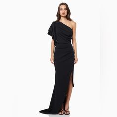 Elliatt Convivial One Shoulder Gown - Black Crafted From Heavy Crepe Fabric, Elliatt's Convivial Gown Offers Sleek Elegance. A Single Frilled Sleeve, Side Split, And Short Train Add Subtle Details For An Unforgettable Look. An Extra Flattering Drape Is Featured Across The Waistline Complete With An Understated One Shouldered Design. Nwt No Care Tag Pre-draped Maxi Cocktail Dress, Full Length Dress For Cocktail Gala, Full Length Cocktail Dress For Gala, Pre-draped Floor-length Evening Gown, Evening Floor-length Pre-draped Gown, Elegant Black Full-length Dress, Pre-draped Maxi Length Cocktail Gown, Pre-draped Maxi Length Evening Gown, Fitted Black Draped Evening Dress