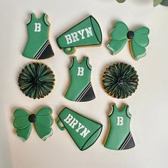 decorated cookies are arranged in the shape of cheerleaders