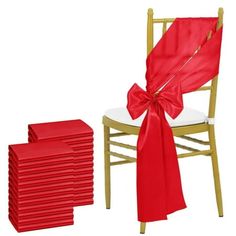 a stack of red chairs with a bow on the back