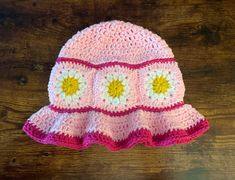 "Samantha \"me\" made crochet pink daisy bucket hat beanie; 90s fashion; daisy sun hat ~~During checkout you will be prompted to select a size the options are; Newborn, 3-6 month, 6-9 month, 12/24, Toddler, Child, Teen/Adult, md adult, large adult. Crochet work stretched quite well. If you have any questions please message me, and i will be glad to help.~~ **Handcrafted from acrylic yarn. There are no hard buttons or eyes on this item. Details are hand sown on with yarn** **Made and shipped from Playful Pink Crochet Hat, Fun Pink Crochet Hat For Beach, Playful Pink Crochet Hat, One Size Fits Most, Retro Pink Summer Hat, Playful Pink Brimmed Crochet Hat, Playful Pink Brimmed Bucket Hat, Pink Crochet Hat, Fun Style, Playful Pink Hand-knitted Crochet Hat, Playful Pink Hand Knitted Hat