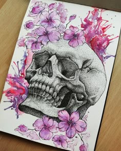 a drawing of a skull with flowers on it