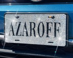 a car license plate with the word azaroff on it's front grill