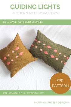 two pillows sitting on top of a bed with the text guiding lights modern pillow pattern