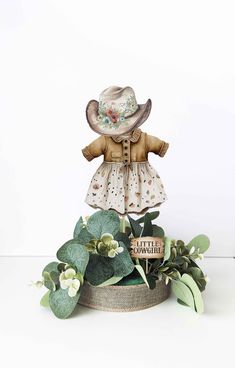 "1 Cowgirl Centerpiece MATCHING ITEMS https://www.etsy.com/shop/HaleyMadisonDesign?ref=l2-shopheader-name&search_query=HM789 WHAT YOU GET One centerpiece: -6.5\" green floral foam covered with burlap ribbon on the edge -4\" Eucalyptus leaves ring -6\" Cowgirl item printed on cardstock double sided TO PURCHASE: 1.Choose the amount of center pieces you'd like on the drop down menu (price is for one centerpiece) 2. Add to cart 3. Complete your purchase You can always message me with any questions! Cow Baby Shower Centerpieces, Western Theme Centerpieces, Cowgirl Centerpieces, Baby Shower Table Set Up, Cowgirl Baby Shower, Cowgirl Baby Showers, Baby Gril, Cow Baby Showers, Cowgirl Baby