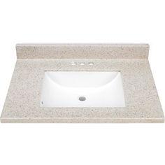 a white bathroom sink sitting on top of a marble countertop next to a faucet