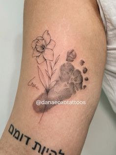 a black and white photo of a flower with the word birth written on it's arm