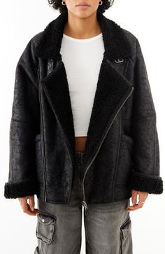 An asymmetric zipper lends moto-inspired edge to this oversized aviator jacket crafted from vintage-inspired faux leather and lined with plush faux shearling. 28" length (size Medium) Exclusive retailer Asymmetric zip closure Notched lapels Front patch pockets 51% viscose, 49% polyester with polyurethane coating; 100% polyester faux-shearling contrast Dry clean Imported Trendy Winter Outerwear With Side Zipper, Black Winter Outerwear With Side Zipper, Black Outerwear With Side Zipper For Winter, Trendy Biker Jacket With Zipper For Cold Weather, Winter Outerwear With Asymmetrical Side Zipper, Winter Leather Jacket With Asymmetrical Zip, Winter Biker Jacket With Side Zipper, Aviator Outerwear With Faux Fur Lining For Fall, Oversized Winter Outerwear With Asymmetrical Zip