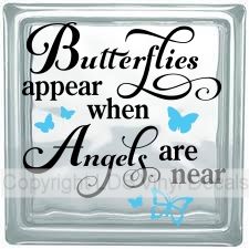 a glass block with the words butterflies appear when angels are near on it's side